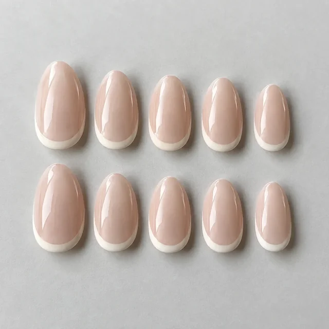 Blush almond press-on nails with ivory micro-French tips